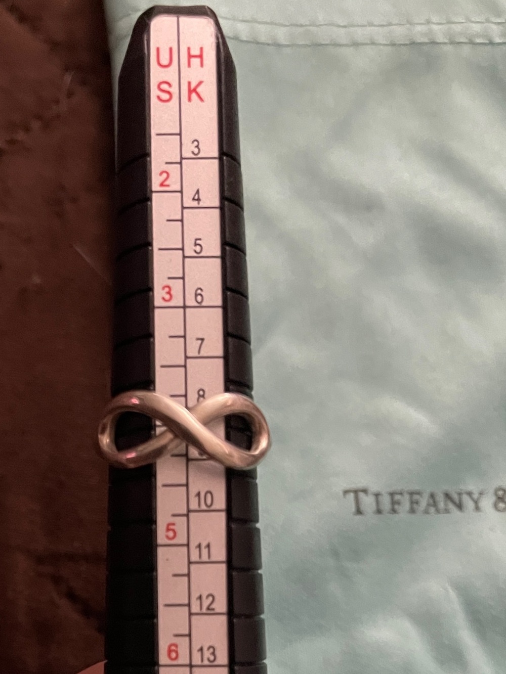 Tiffany & Co. Sterling silver infinity ring with Blue Pouch size 4